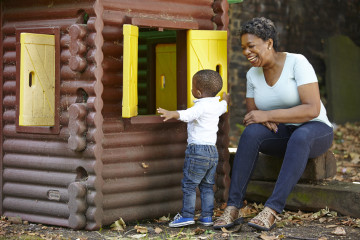 Mum and son explore playhouse