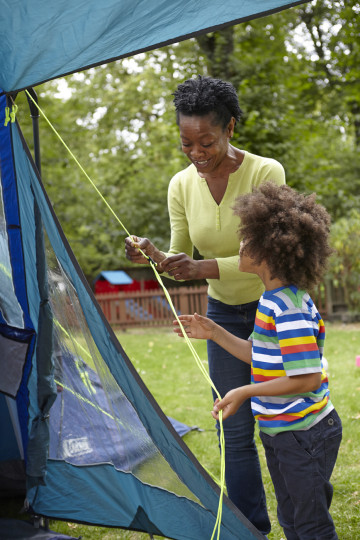 Mum and son adjust tent